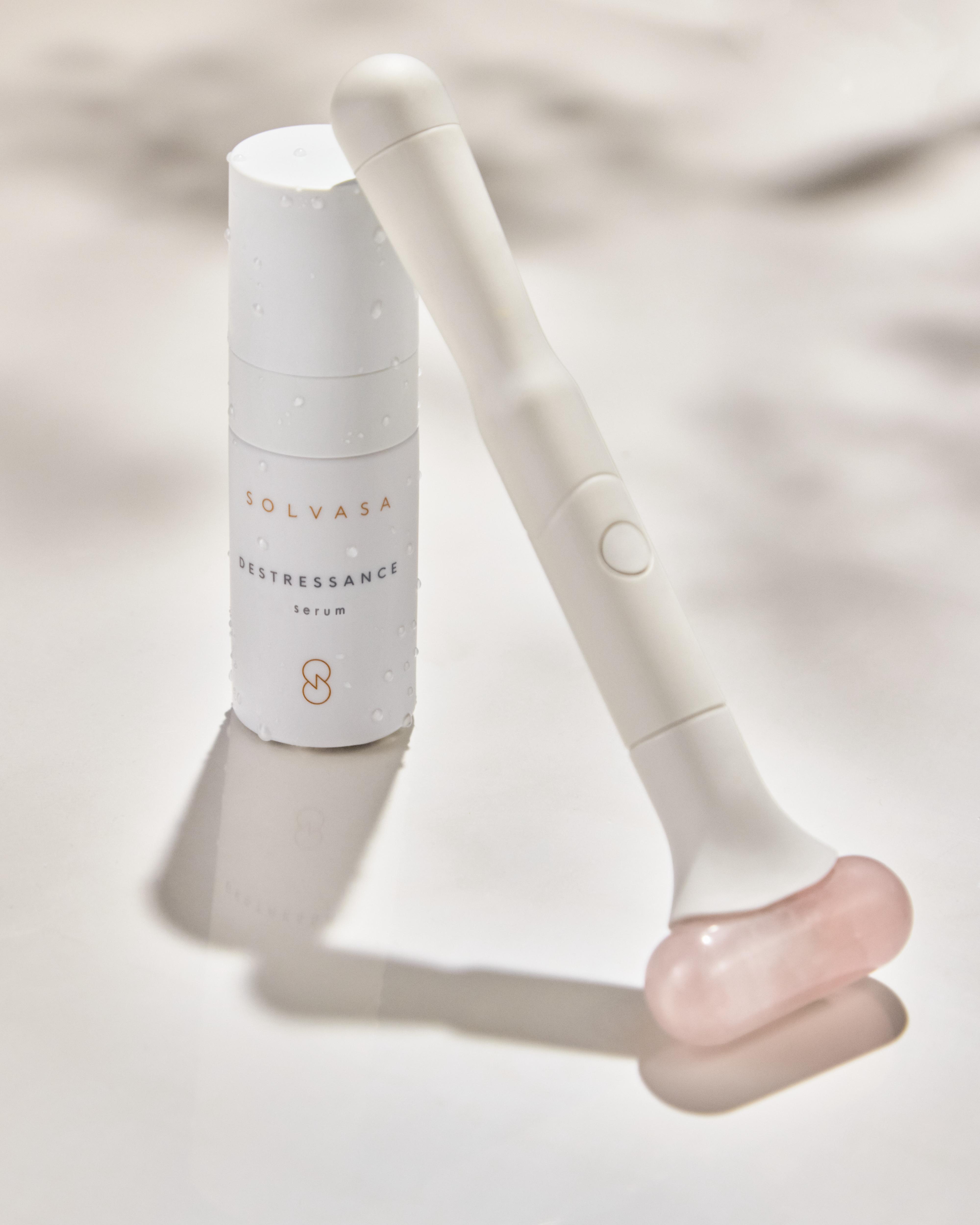 A single green leaf against a white background.